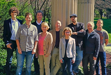 Photo of faculty posed by columns.